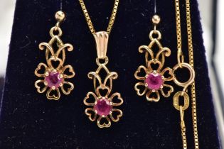 A MATCHING PENDANT NECKLACE AND EARRING SET, the pendant designed as an openwork flower, set with