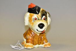 A CROWN DEVON SEATED CHARACTER ARMY DOG, modelled wearing hat and army jacket with two stripes to