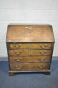 A GEORGIAN OAK BUREAU, with a fitted interior, and four exterior drawers, width 87cm x depth 49cm