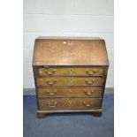 A GEORGIAN OAK BUREAU, with a fitted interior, and four exterior drawers, width 87cm x depth 49cm