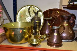 A QUANTITY OF BRASS AND COPPERWARE, comprising of three Georgian copper measuring jugs (quart,