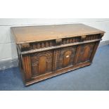 A REPRODUCTION SOLID OAK BLANKET CHEST, with triple arched panels, width 117cm x depth 48cm x height