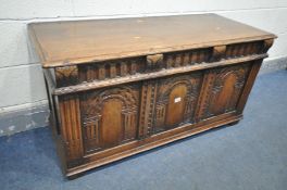 A REPRODUCTION SOLID OAK BLANKET CHEST, with triple arched panels, width 117cm x depth 48cm x height