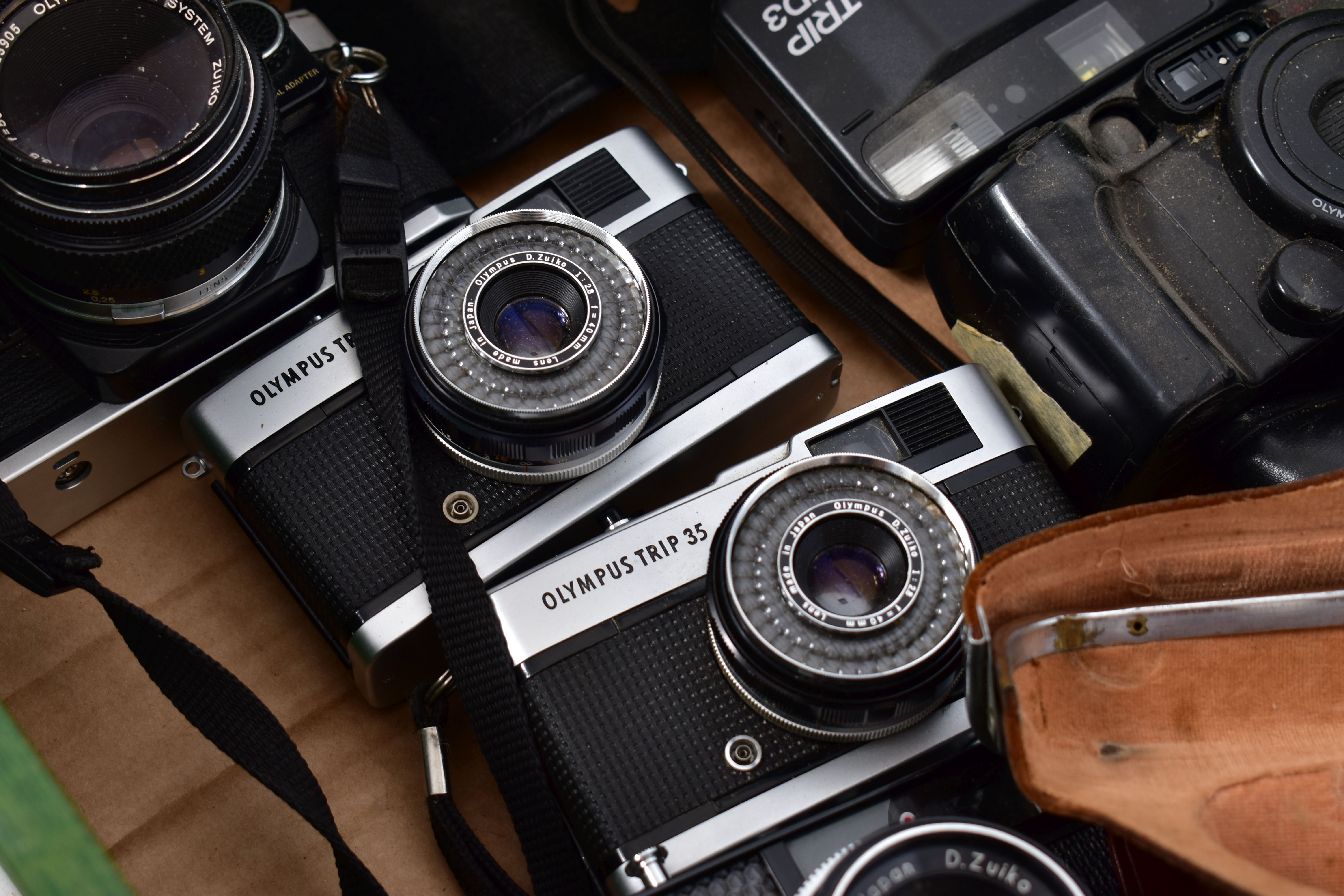 A TRAY CONTAINING OLYMPUS SLR AND INSTANT CAMERAS including a black OM2 with 50mm lens, a chrome - Image 2 of 5