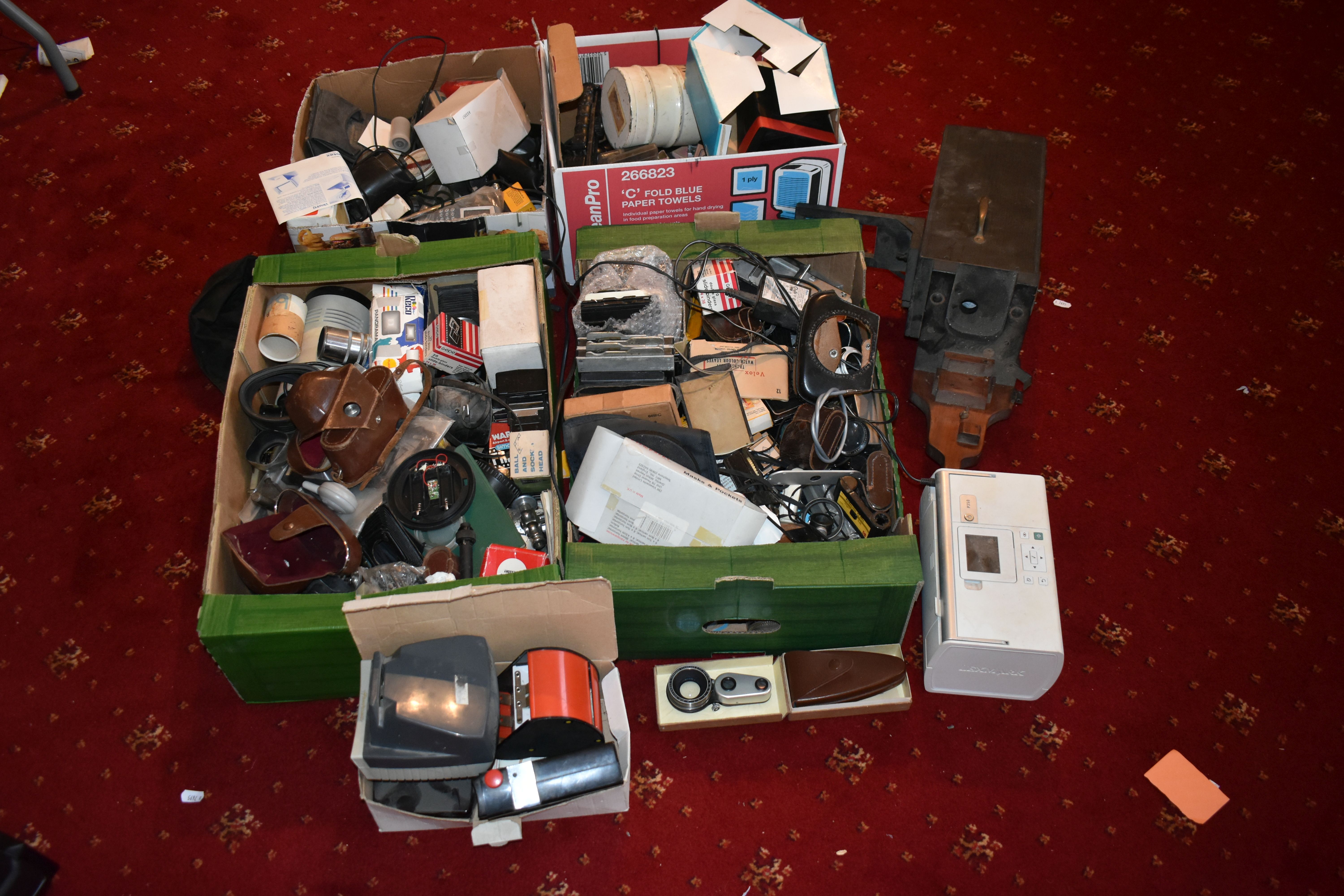 FOUR TRAYS CONTAINING CAMERA PARTS AND ACCESSORIES including a Schneider Focorect, a Lexmark