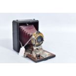 A MANHATTAN OPTICS POCKET WIZARD FIELD CAMERA with black covering over mahogany frame