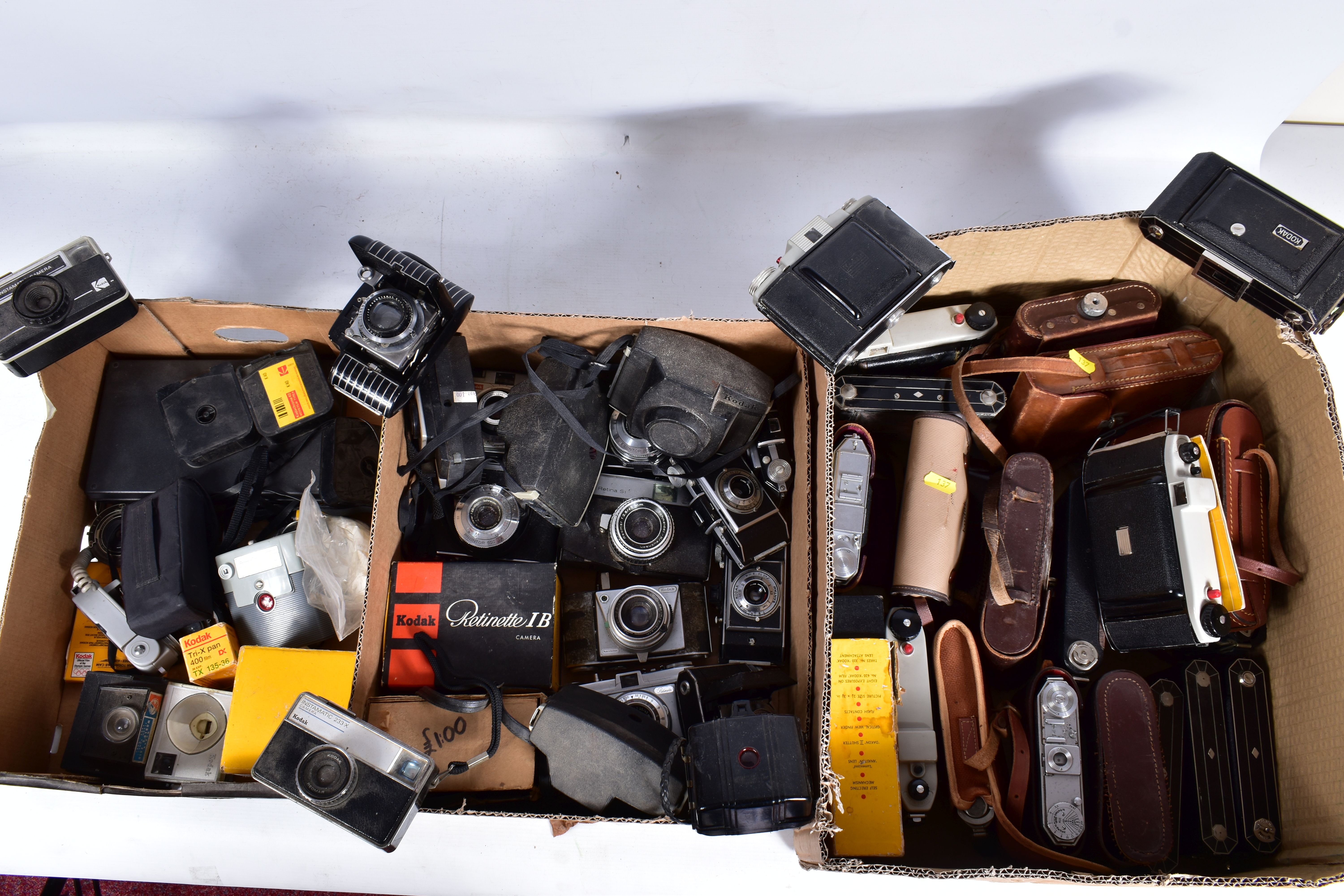 THREE TRAYS CONTAINING EIGHTEEN KODAK FOLDING CAMERAS, thirteen instant cameras, and shutter release