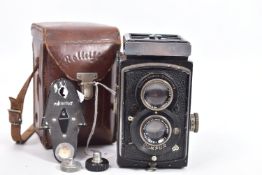 A ROLLEIFLEX 6RF 622 TLR CAMERA fitted with an Anastigmat 7.5cm f3.1 lens and a Tessar 75cm f3.8