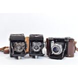 THREE ZEISS IKON SUPER IKONTA FOLDING FILM CAMERAS comprising of a 532/16 in leather case ( covering