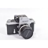 A NIKON F PHOTOMIC FILM SLR CAMERA fitted with a Nikkor-H Auto 28mm f3.5 lens ( tidy but some