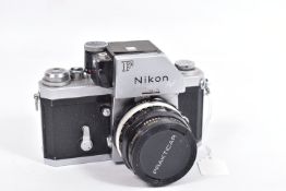 A NIKON F PHOTOMIC FILM SLR CAMERA fitted with a Nikkor-H Auto 28mm f3.5 lens ( tidy but some