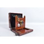 A MAHOGANY AND BRASS FIELD CAMERA fitted with an Eastman Kodak Shutter release, a Bauch and Lomb