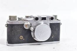 A 1946 LEICA lllC RANGEFINDER CAMERA with an Elmar 3.5cm f3.5 lens and cap