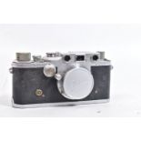 A 1946 LEICA lllC RANGEFINDER CAMERA with an Elmar 3.5cm f3.5 lens and cap