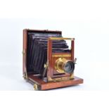 A MAHOGANY AND BRASS FIELD CAMERA for 4x6in plates with a Mount Bros lens