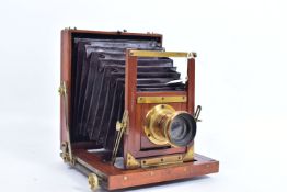 A MAHOGANY AND BRASS FIELD CAMERA for 4x6in plates with a Mount Bros lens