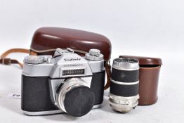 A VOIGTLANDER BESSAMATIC SLR CAMERA in case fitted with a 50mm f2.8 lens, a case for 50mm lens and a