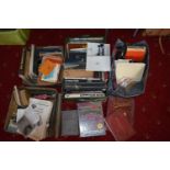 THREE TRAYS AND TWO BAGS CONTAINING BOOKS AND MANUALS on the subject of photography and cameras