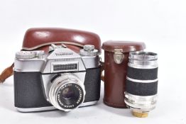 A VOIGTLANDER BESSAMATIC SLR CAMERA in case fitted with a 50mm f2.8 lens and a Super Dynarex 135mm