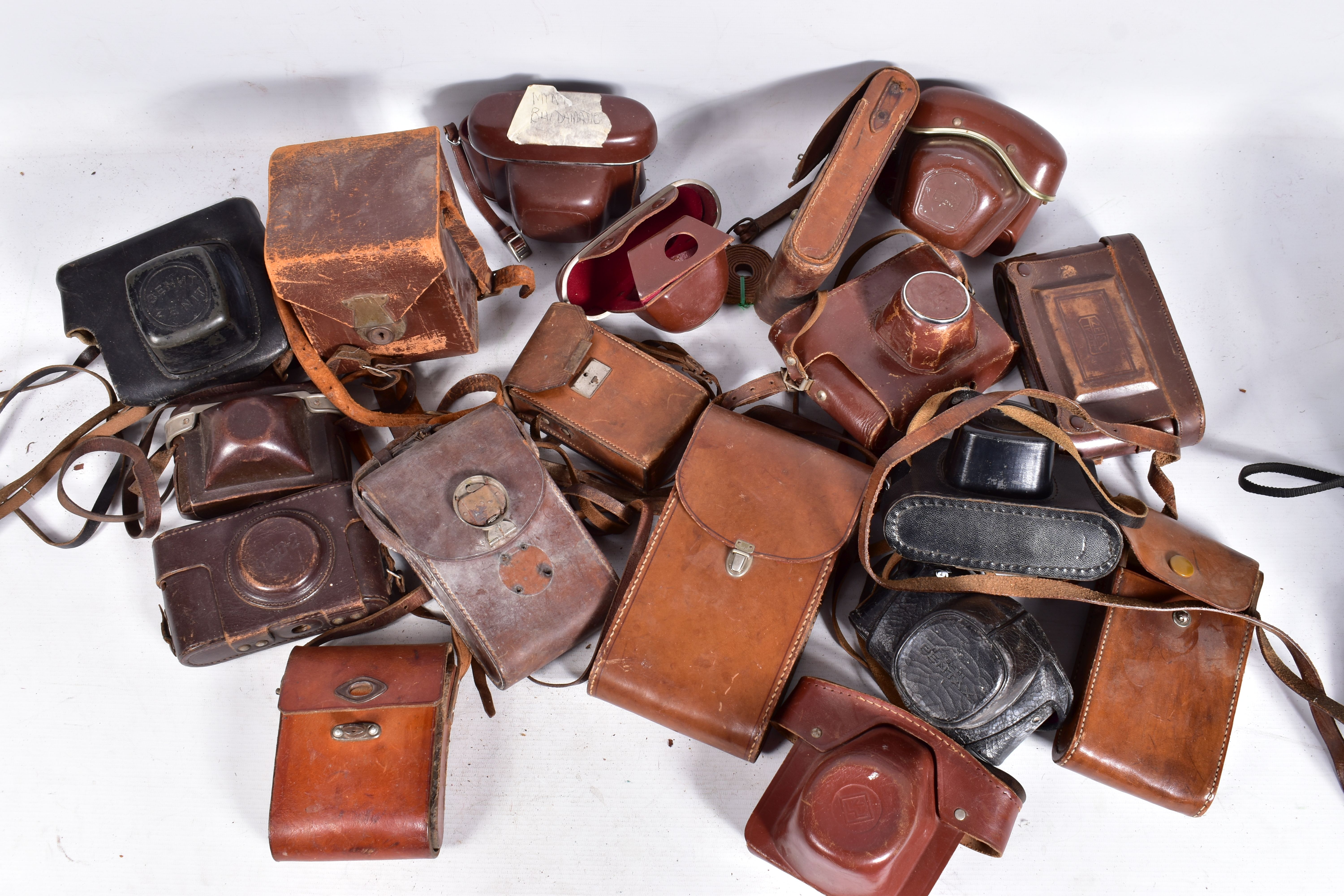 A TRAY CONTAINING A QUANTITY OF LEATHER CAMERA CASES by Zeiss Ikon, FED, Zorki, Braun, etc