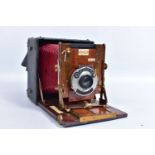 A SANDERSON JUNIOR FOLDING BOX CAMERA with Koilos Shutter release, a CP Goerz series lll no2 lens