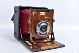 A SANDERSON JUNIOR FOLDING BOX CAMERA with Koilos Shutter release, a CP Goerz series lll no2 lens