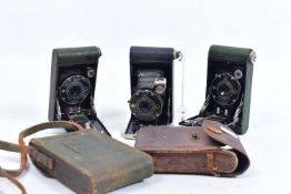 TWO BOY SCOUT KODAK AND ONE GIRL GUIDE KODAK FOLDING CAMERAS one with a green Boy Scout leather