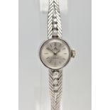 A MID 20TH CENTURY DIAMOND WHITE METAL MANUAL WIND WRISTWATCH, the circular silver tone dial, with