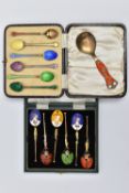 A CASED SET OF SIX GEORGE V SILVER GILT AND HARLEQUIN ENAMEL COFFEE SPOONS, engine turned decoration