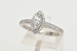 A PLATINUM DIAMOND HALO RING, centring on a marquise cut diamond, estimated diamond weight 0.