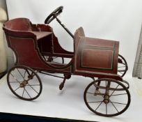 A WOODEN BODIED PEDAL CAR, early 20th Century, open body in the style of a Edwardian saloon with