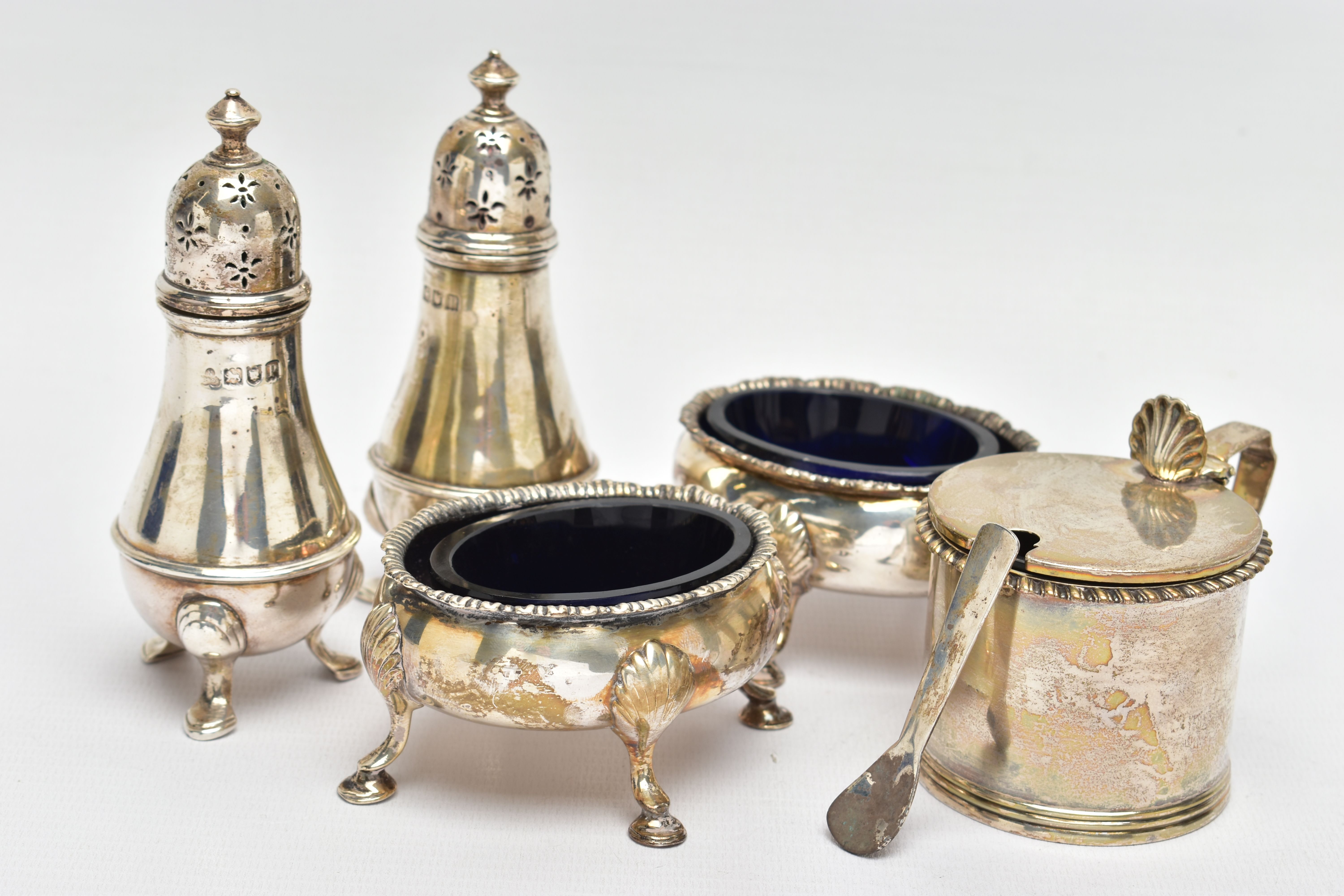 A PAIR OF GEORGE III SILVER OVAL SALTS AND THREE OTHER SILVER CRUET ITEMS, the oval salts with