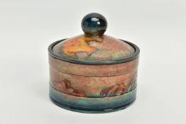 A WILLIAM MOORCROFT FLAMBE JAR AND COVER, of circular form, (probably a humidor), spherical