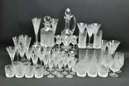 A SUITE OF STUART CRYSTAL BEACONSFIELD PATTERN DRINKING GLASSES AND DECANTERS, comprising a square