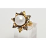 A WHITE AND YELLOW METAL CULTURED PEARL RING, of foliate design, set with a principal part drilled