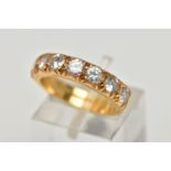 A MODERN 18CT YELLOW GOLD DIAMOND SEVEN STONE RING, set with round brilliant cut diamonds, measuring