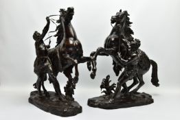 AFTER GUILLAME COUSTEAU, A 19TH CENTURY PAIR OF PATINATED BRONZE MARLY HORSES, with attendants, on