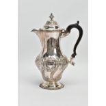 A LATE VICTORIAN SILVER HOT WATER JUG OF BALUSTER FORM, the hinged domed cover with knopped