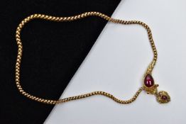 A VICTORIAN GARNET SET GOLD SNAKE NECKLACE, the serpent's head set with a pear shape garnet cabochon