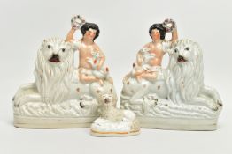 A PAIR OF VICTORIAN STAFFORDSHIRE POTTERY FIGURE GROUPS, modelled as a naked boy holding a garland a