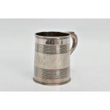 A GEORGE III SILVER CHRISTENING MUG OF TAPERED CYLINDRICAL FORM WITH REEDED BANDS, engraved initials