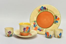SIX PIECES OF CLARICE CLIFF AUTUMN CROCUS PATTERN ITEMS, comprising three egg cups with Bizarre