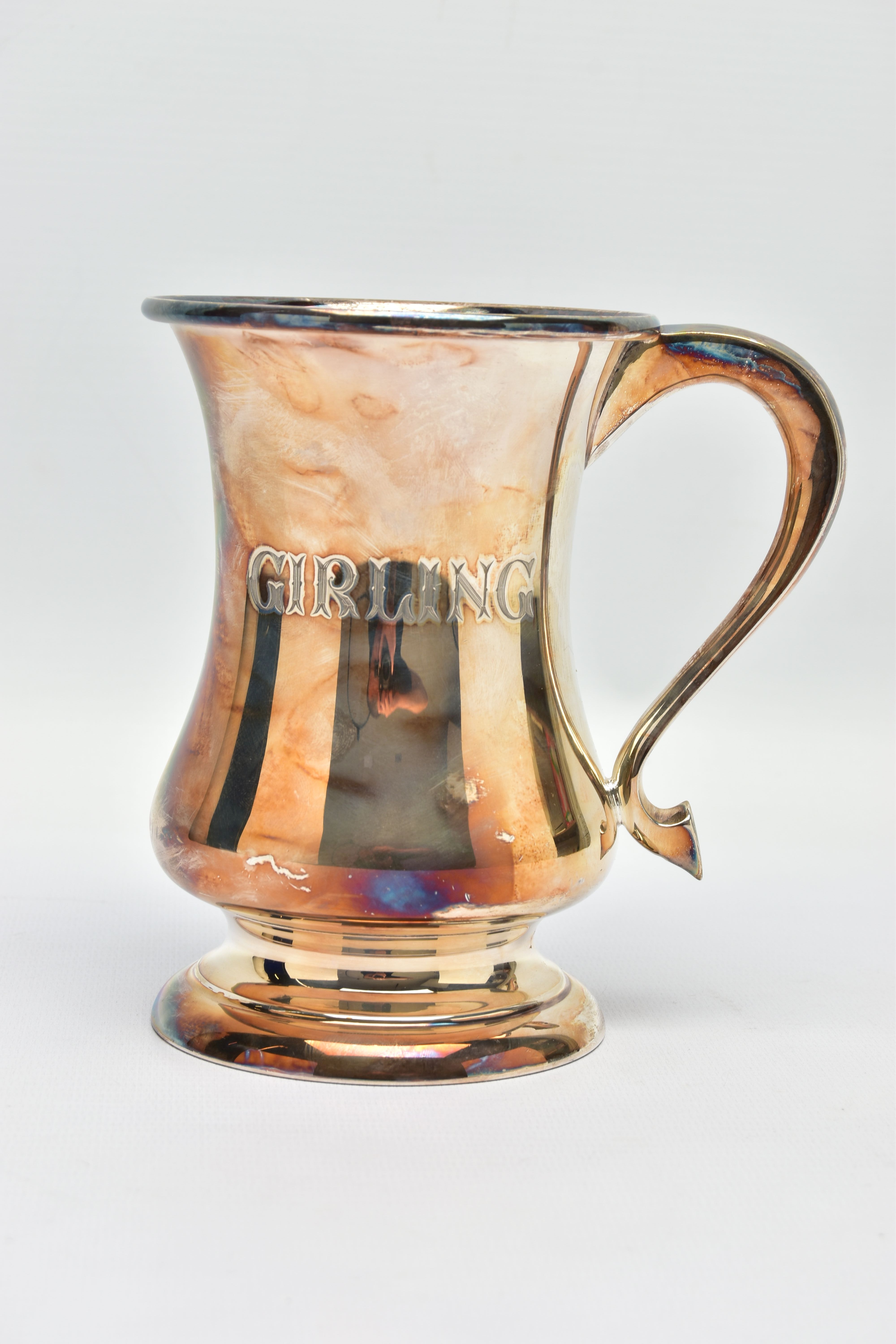 AN ELIZABETH II SILVER TANKARD OF BALUSTER FORM, with scrolled handle, raised on a circular domed