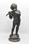 A LATE 19TH / EARLY 20TH CENTURY CAST LEAD GARDEN FIGURE OF A BOY PLAYING A FLUTE, standing on a