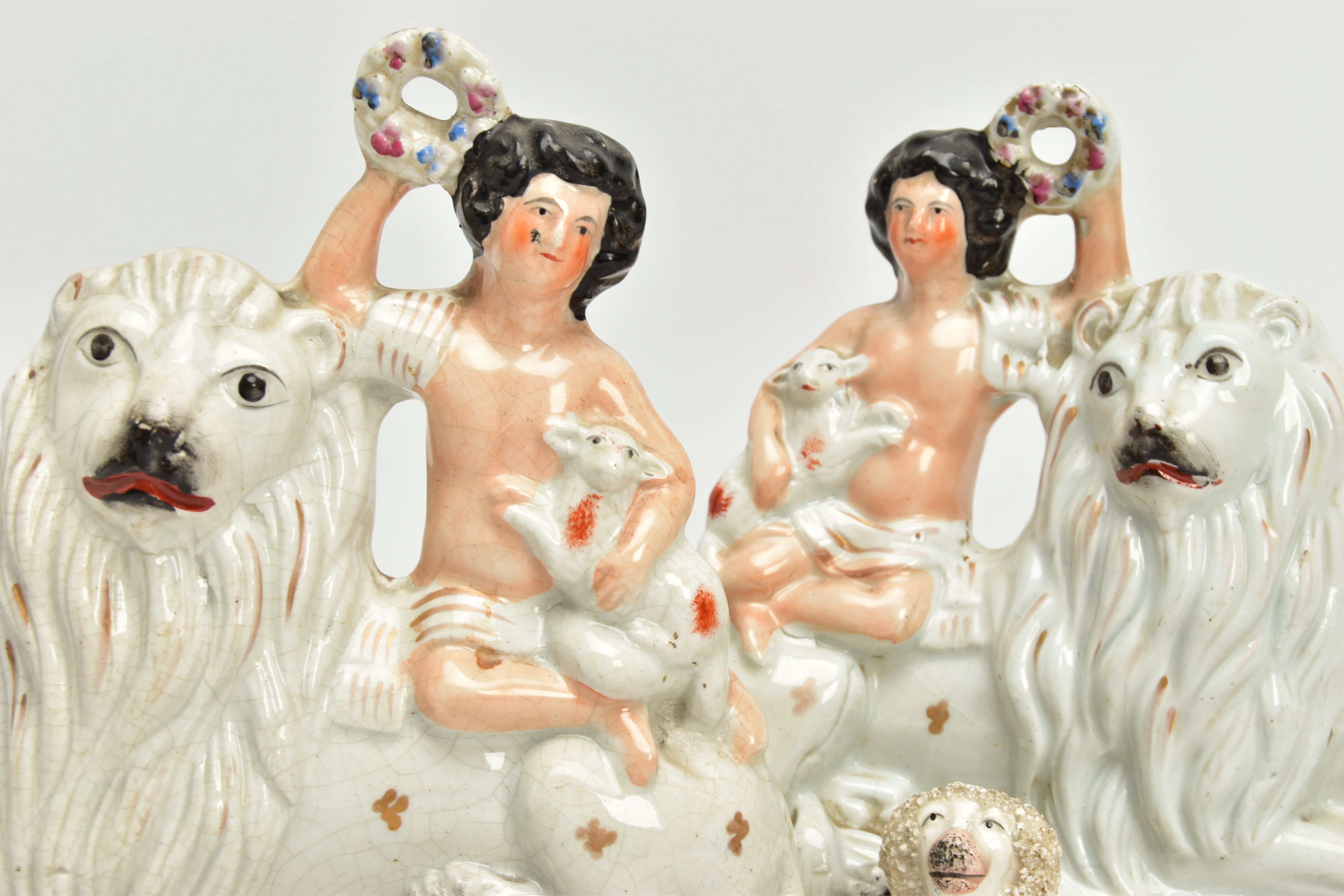 A PAIR OF VICTORIAN STAFFORDSHIRE POTTERY FIGURE GROUPS, modelled as a naked boy holding a garland a - Image 7 of 8