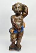 A CARVED WOODEN SUPPORT IN THE FORM OF A PUTTI, with later polychrome decoration and later