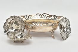 A GEORGE V SILVER OVAL DISH, the foliate pierced rim above a plain bowl, on four cabriole legs