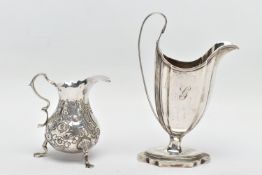 TWO 18TH CENTURY SILVER CREAM JUGS, comprising a George III helmet shaped pedestal cream jug with