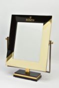 A ROLEX RETAILER'S COUNTER TOP MIRROR, the rectangular swing mirror with black and cream lacquered