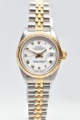 A ROLEX DATEJUST WRISTWATCH, the white dial with gold tone luminescent Roman Numerals, gold tone